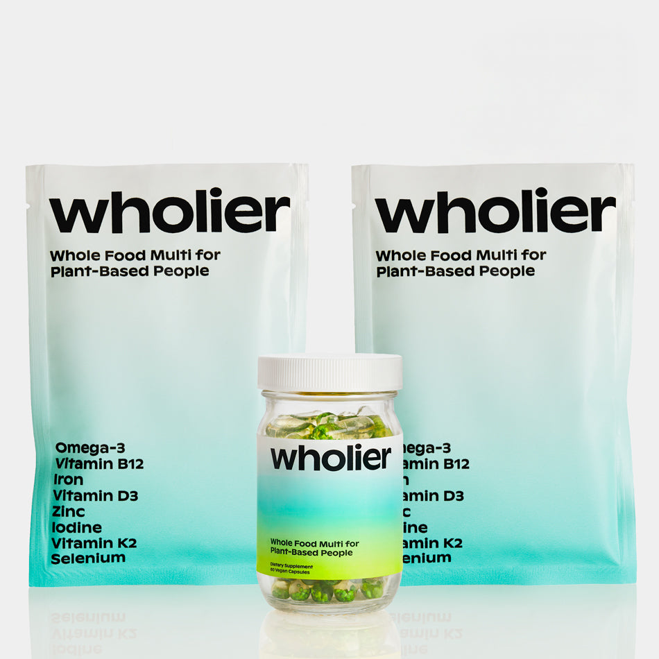 A single green leaf against a white background.