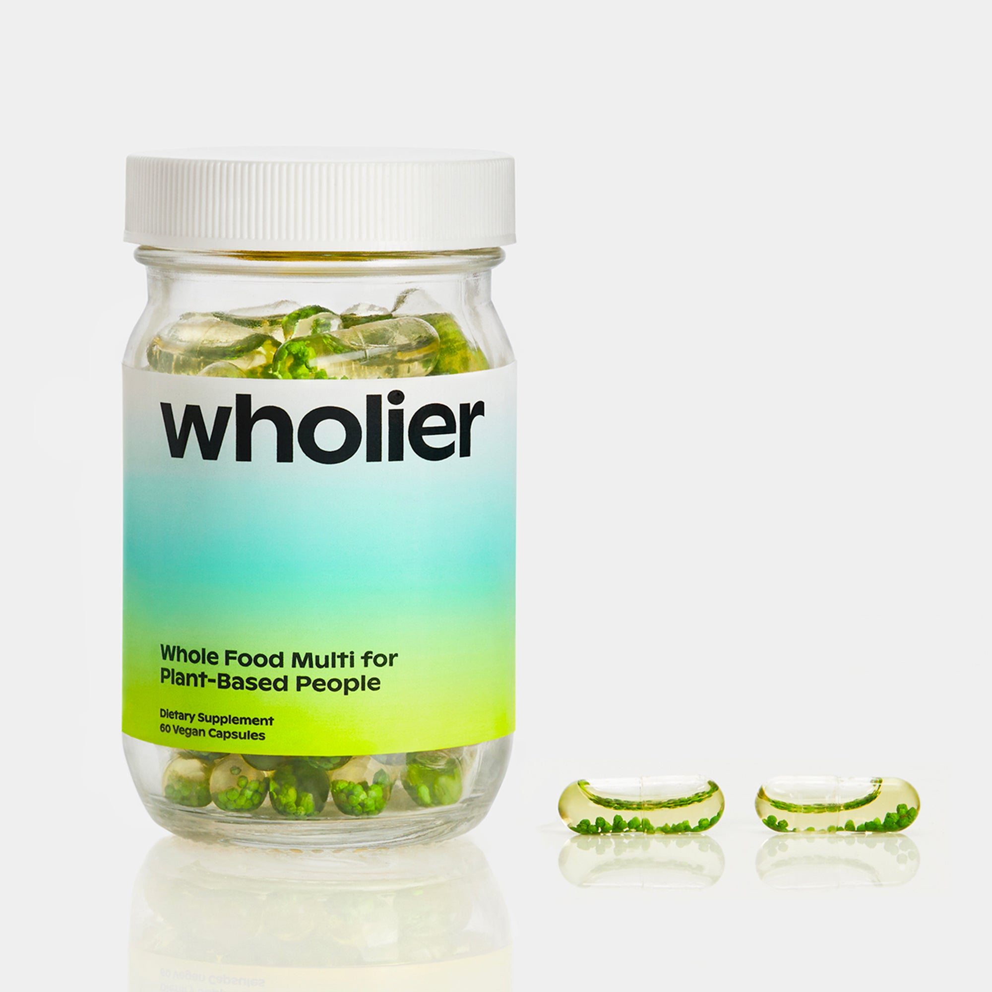 A single green leaf against a white background.