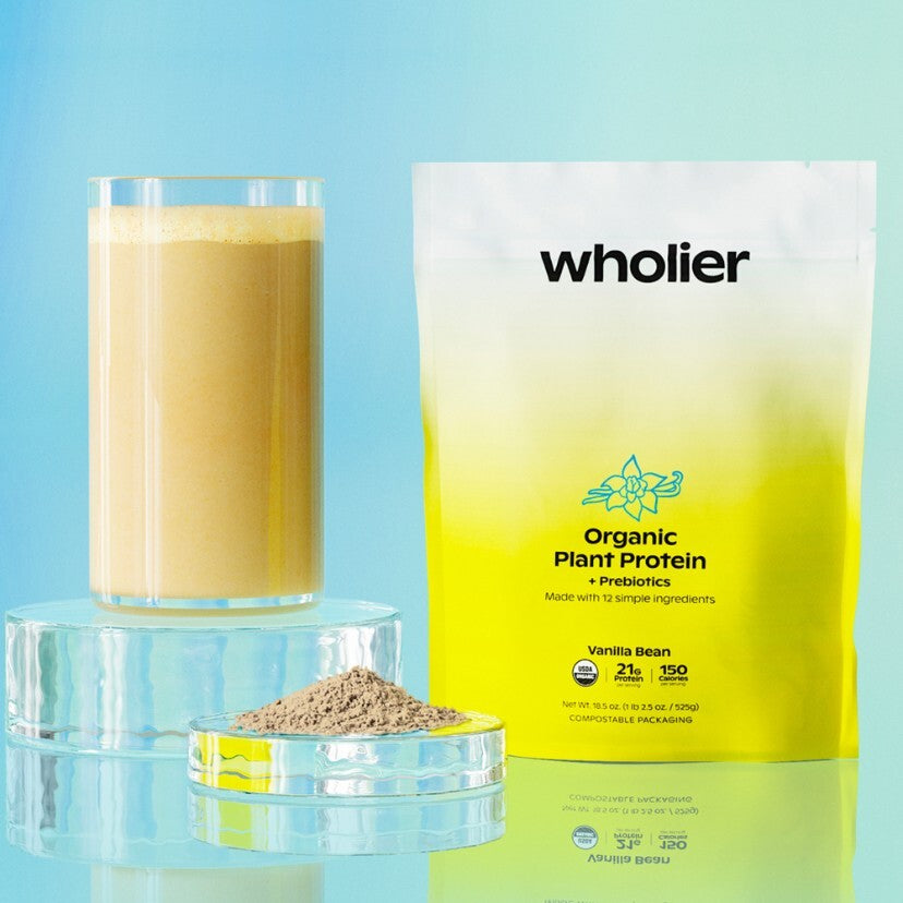 wholier Organic Plant Protein Vanilla Bean pouch with a shake and scoop of powder