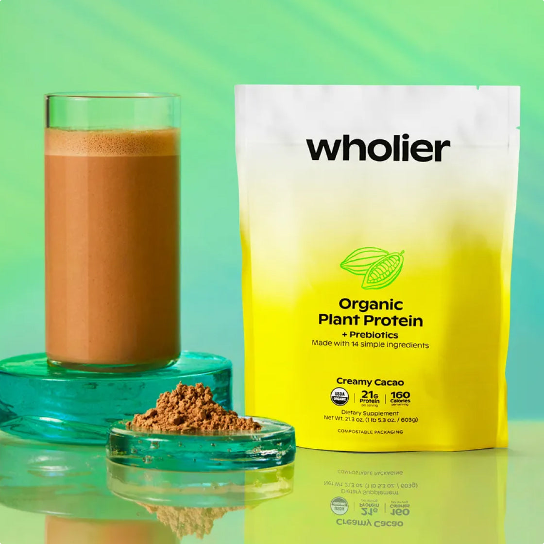 Organic Plant Protein Creamy Cacao pouch beside a blended cacao shake