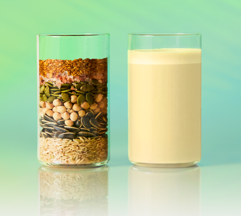 One glass layered with the raw organic ingredients, one glass of the blended shake