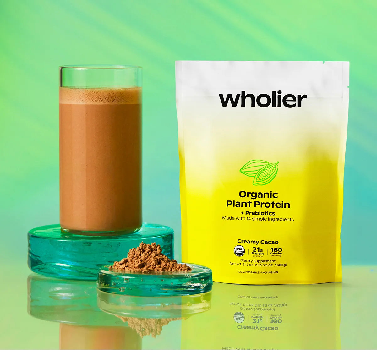 Creamy Cacao pouch beside a glass of the blended shake
